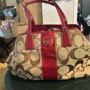 Coach bag Signature print fabric shiny maroon trim. I believe leather handles???